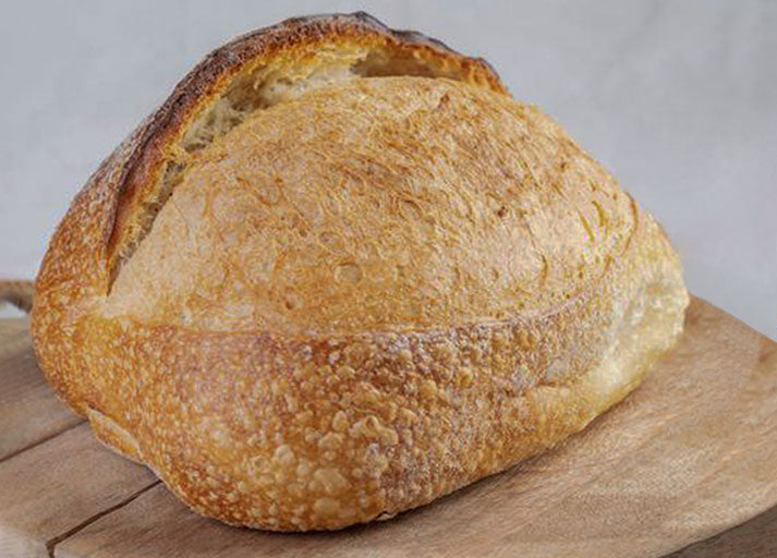 White Alsatian loaf with open crumb and perfectly crusted top
